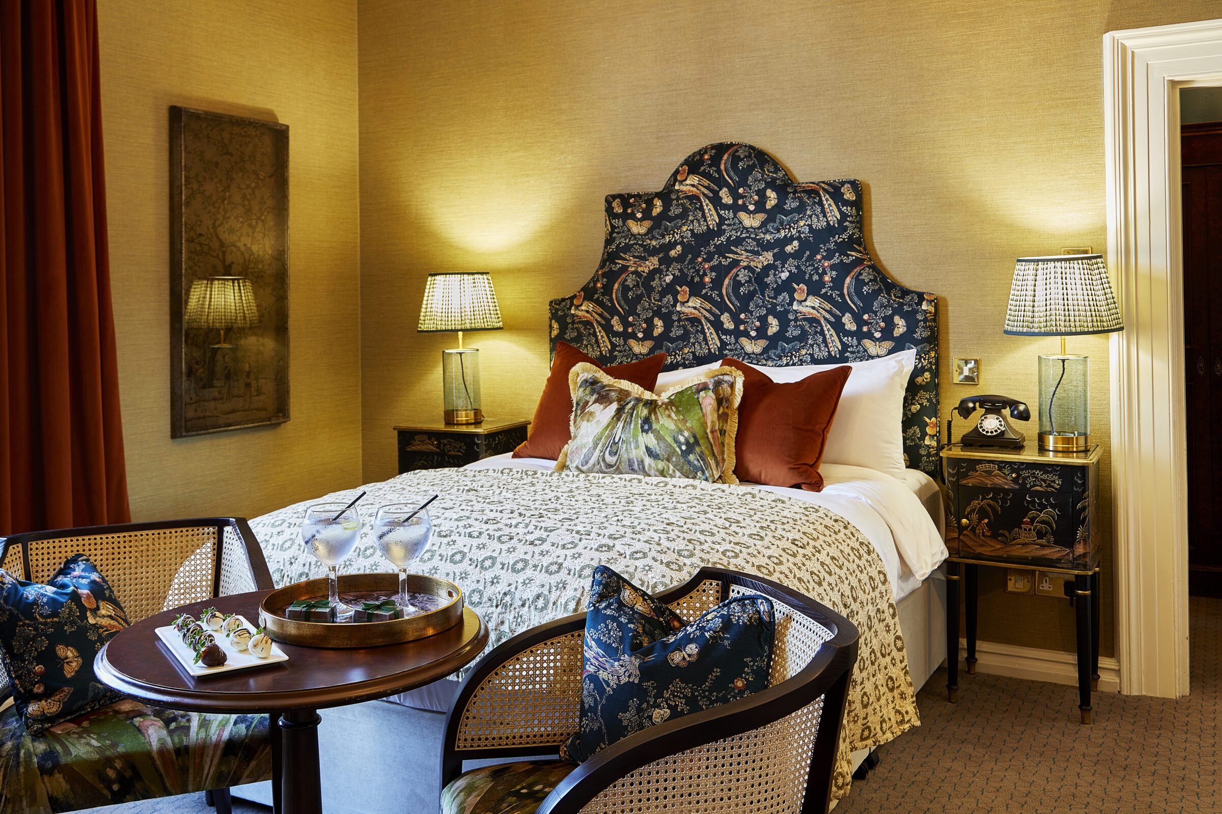 Burnham Beeches Hotel bedroom featuring bespoke Bourne Furniture, including headboard, tables, and seating