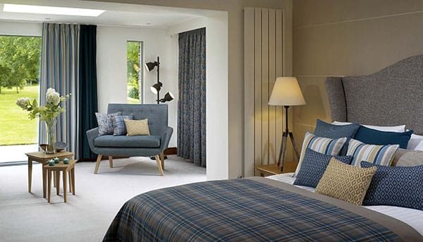 Bedroom furniture and cushions upholstered in Aviemore acoustic fabric by Panaz, designed for comfort and neurodiversity-friendly spaces