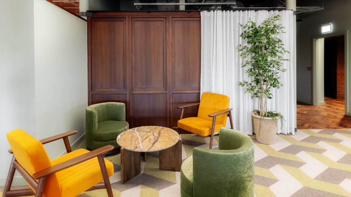 Weave co-working space showing a table and 4 armchairs.